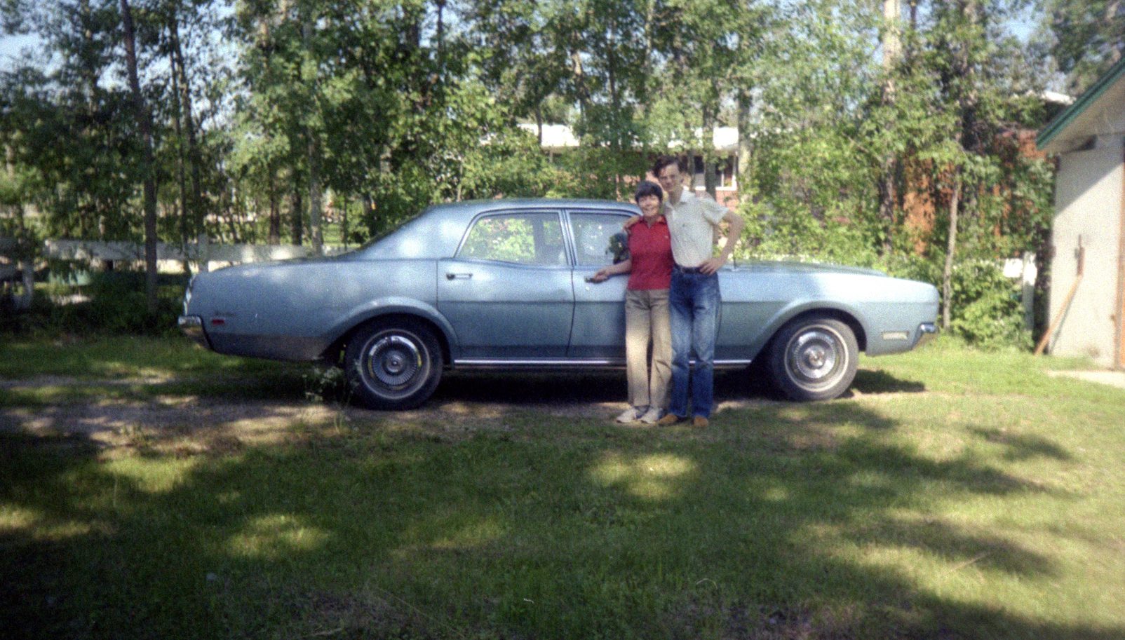 Frances with her son and car in 1984